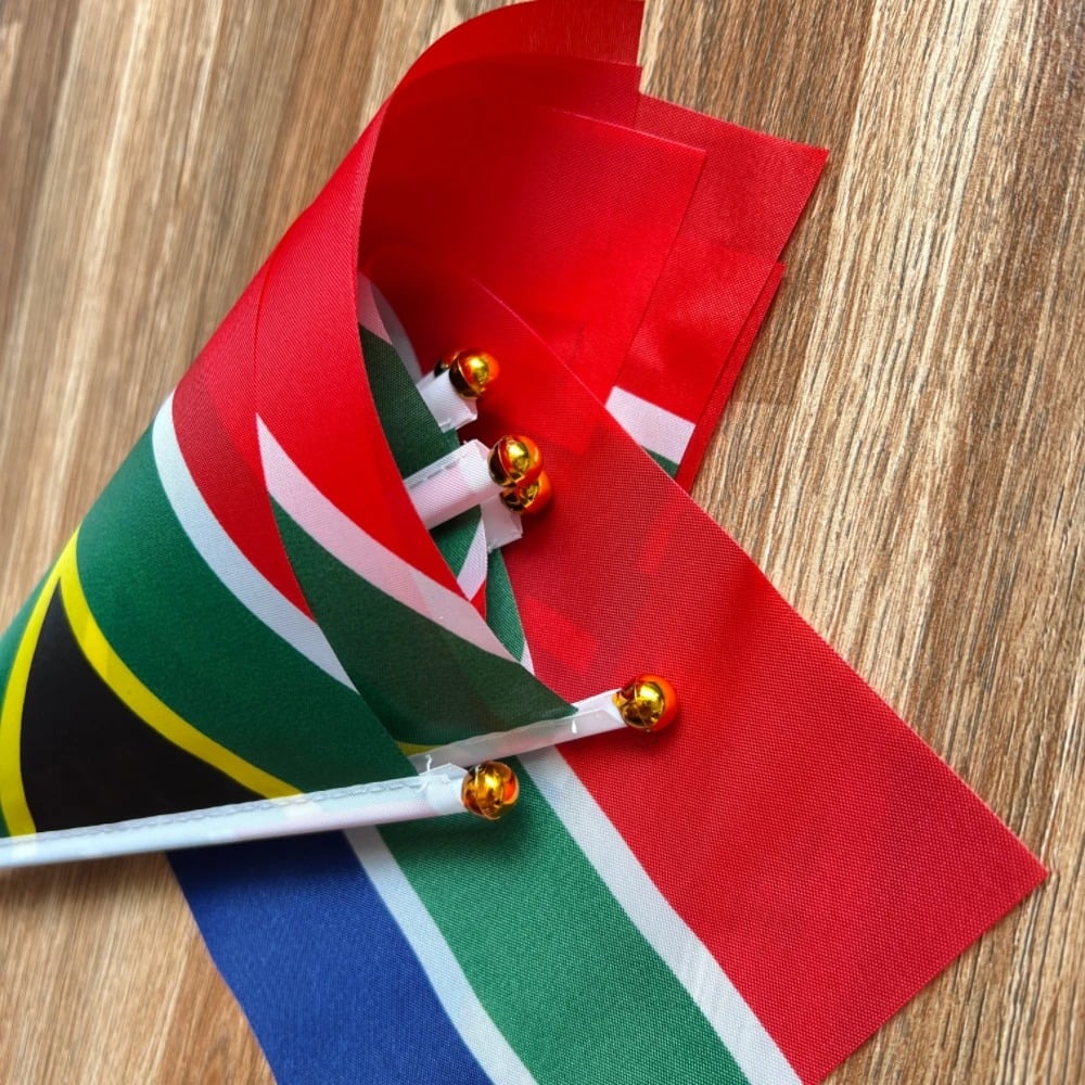 Pack of ten small South African hand flags on white poles