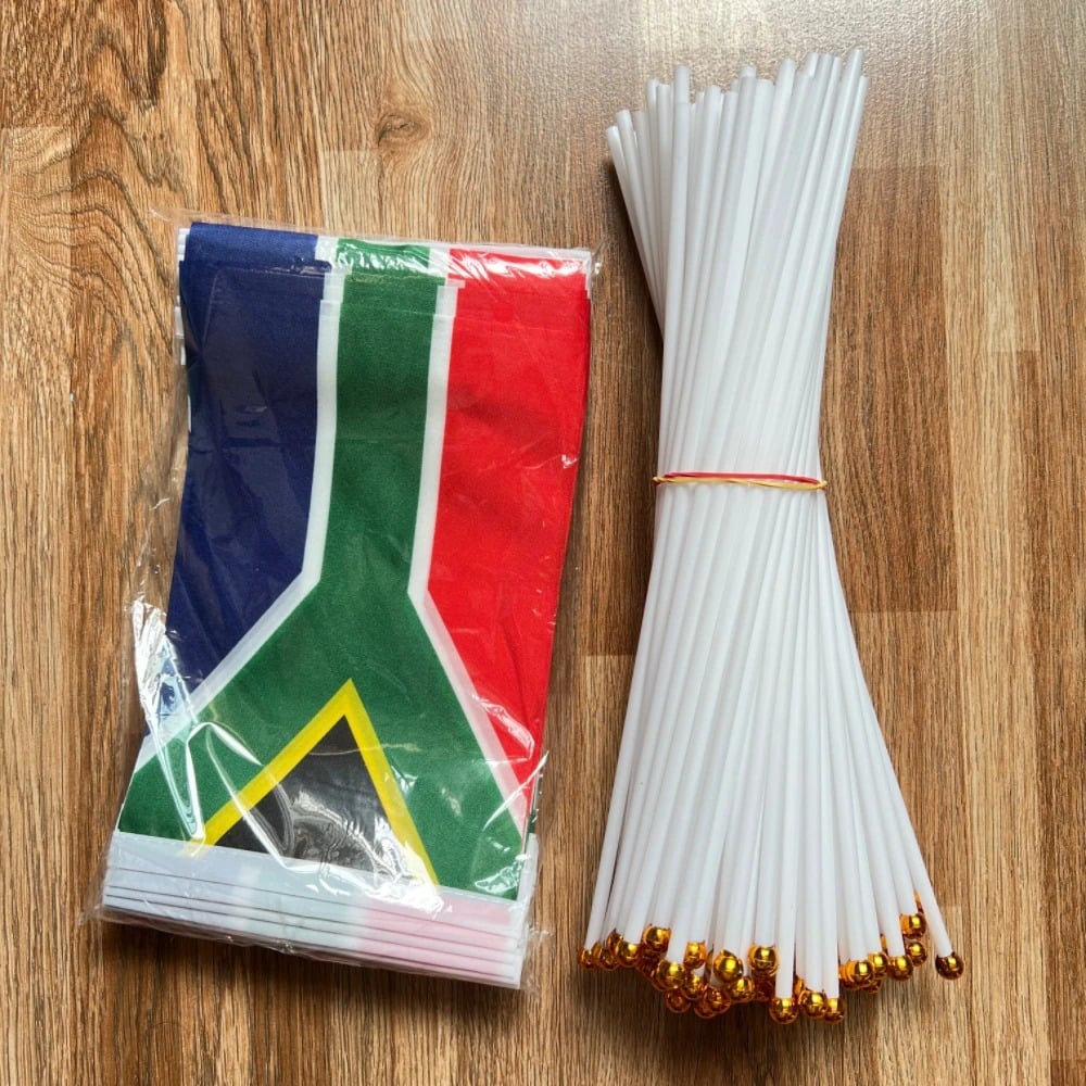 Pack of ten small South African hand flags on white poles