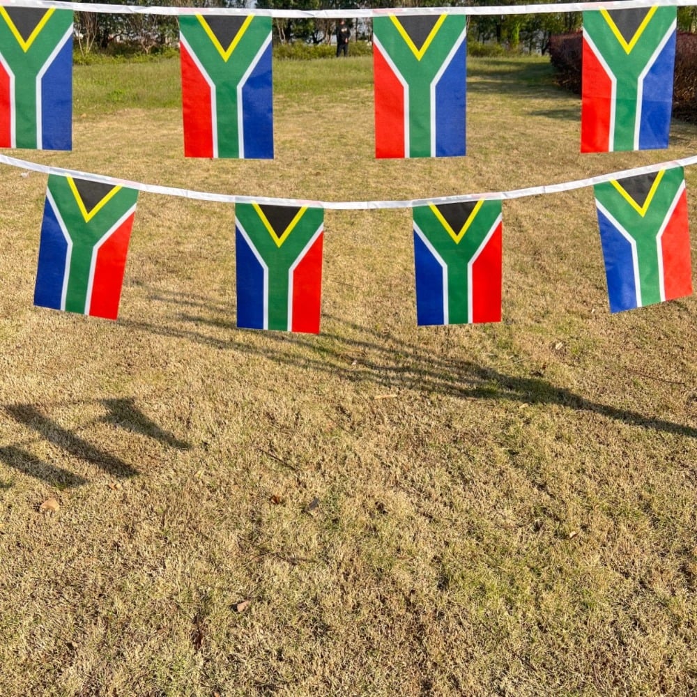 String of South African flag bunting hung outdoors