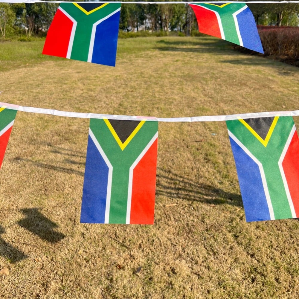 String of South African flag bunting hung outdoors