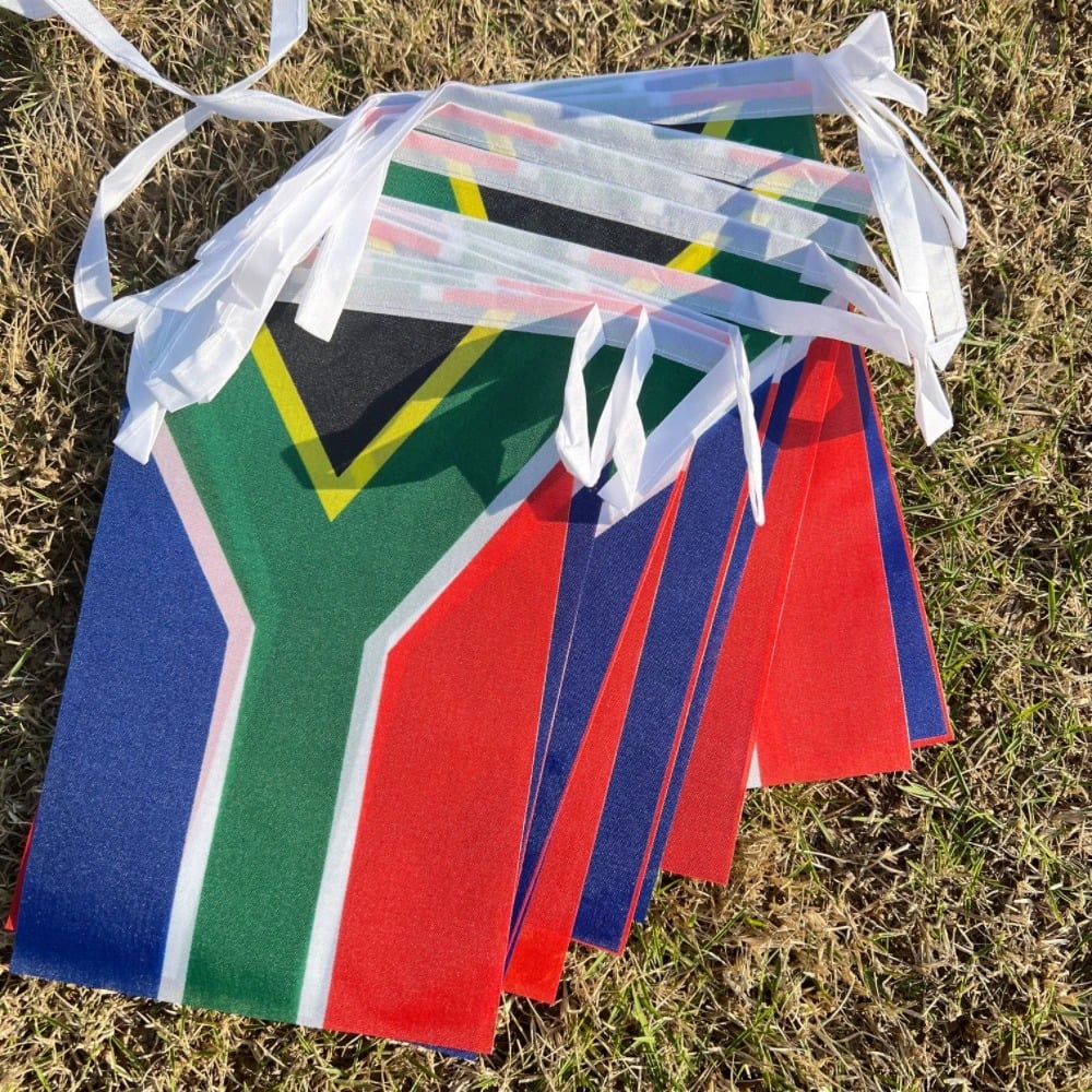 String of South African flag bunting hung outdoors