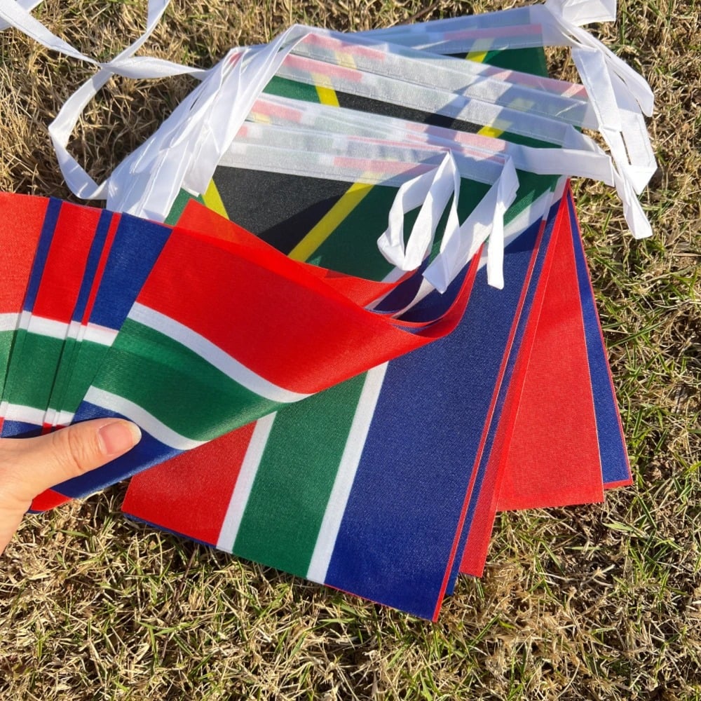 String of South African flag bunting hung outdoors