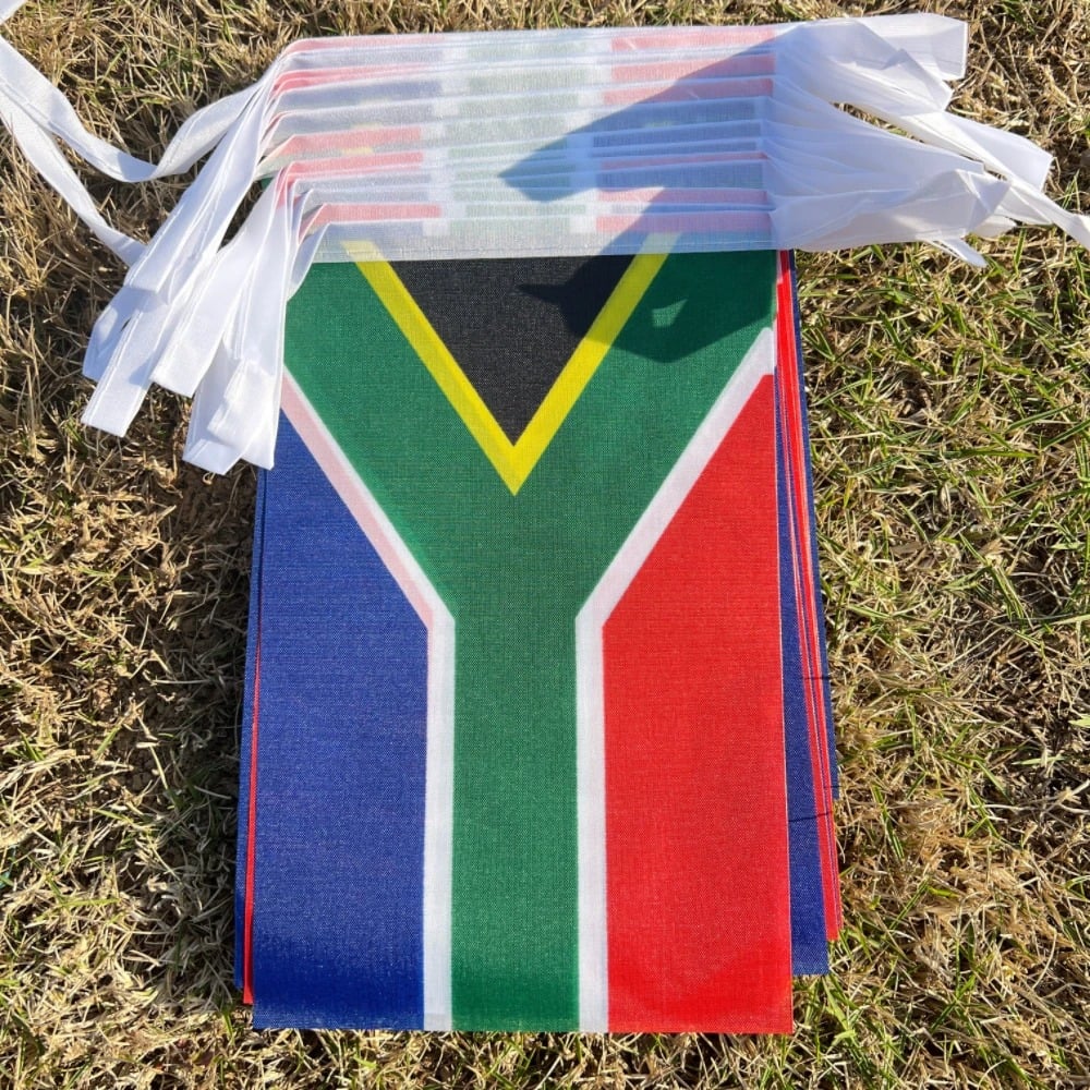 String of South African flag bunting hung outdoors