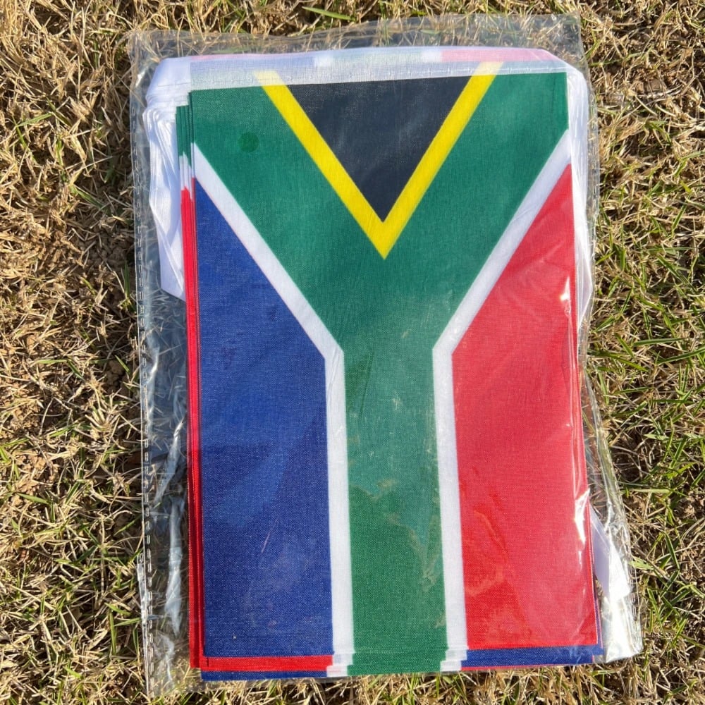 String of South African flag bunting hung outdoors